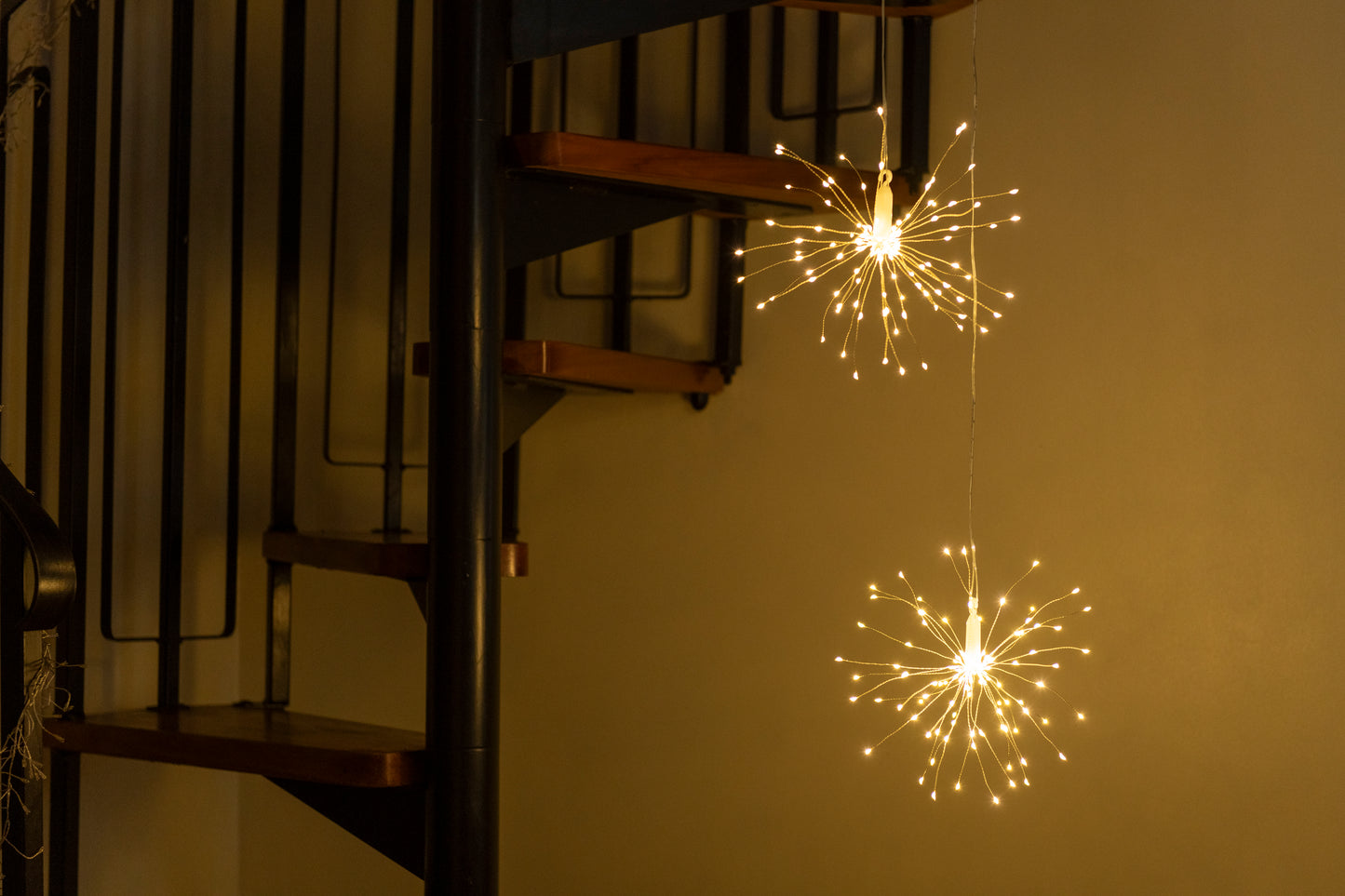 Hanging firework light warm light ornament. Battery operated use inside or outside.