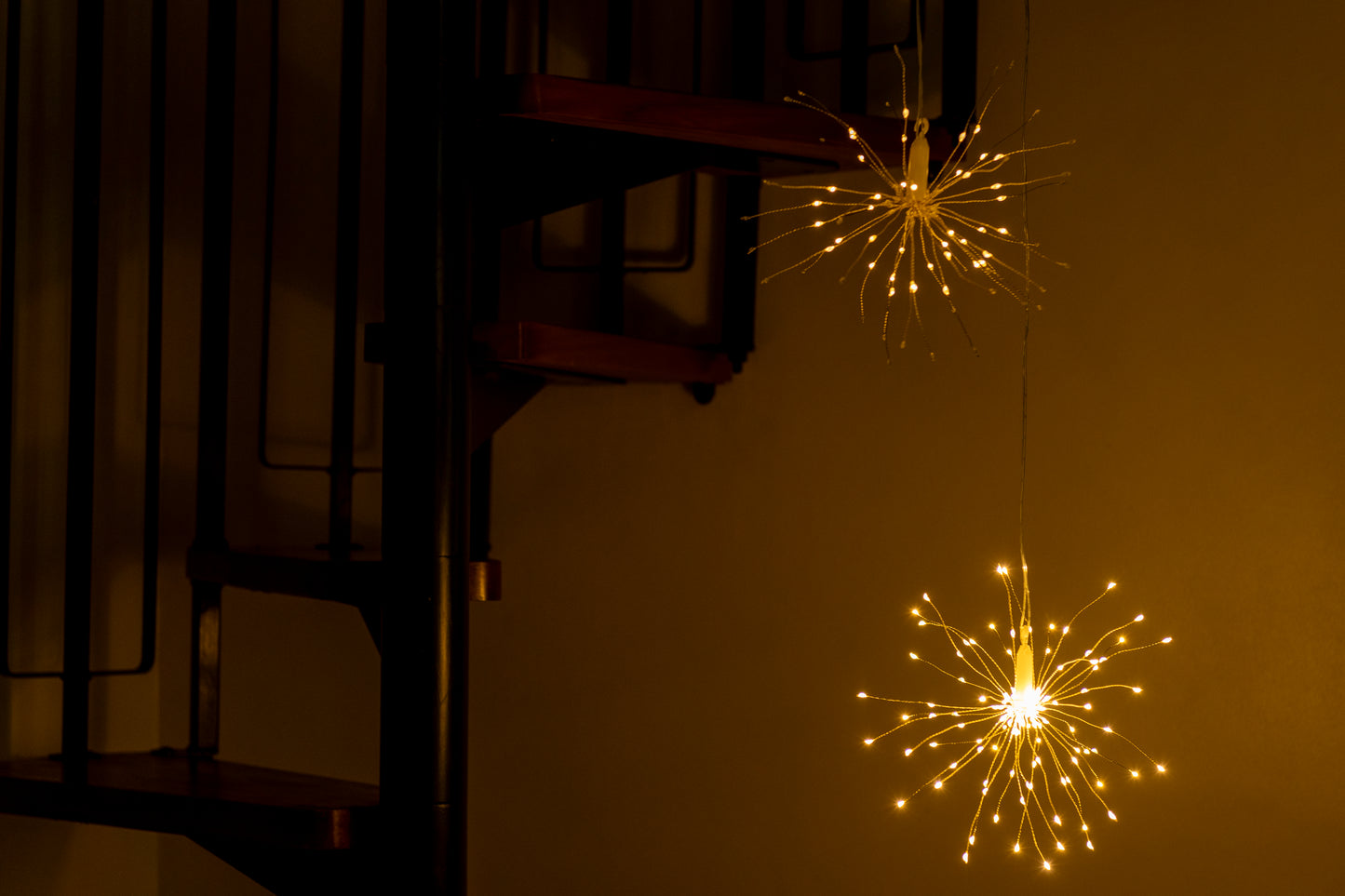Hanging firework light warm light ornament. Battery operated use inside or outside.