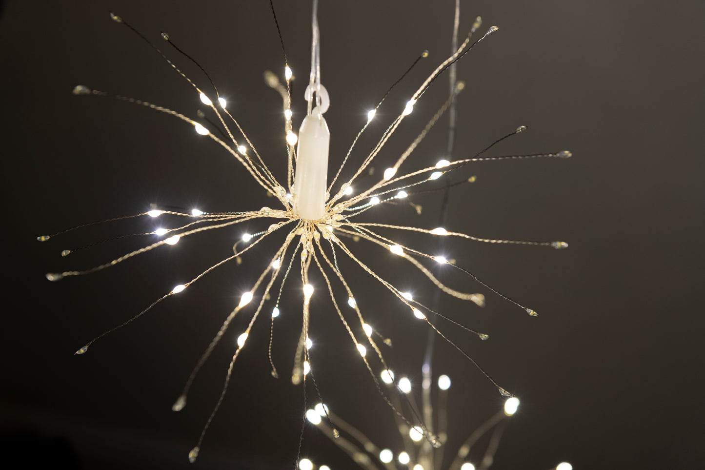 Hanging firework light warm light ornament. Battery operated use inside or outside.