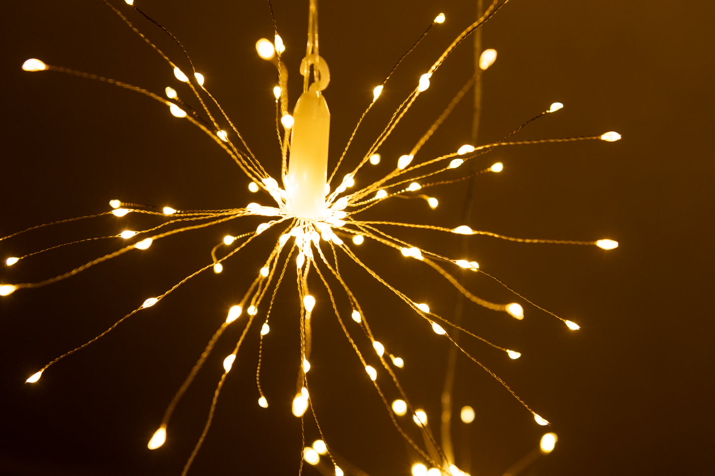 Hanging firework light warm light ornament. Battery operated use inside or outside.