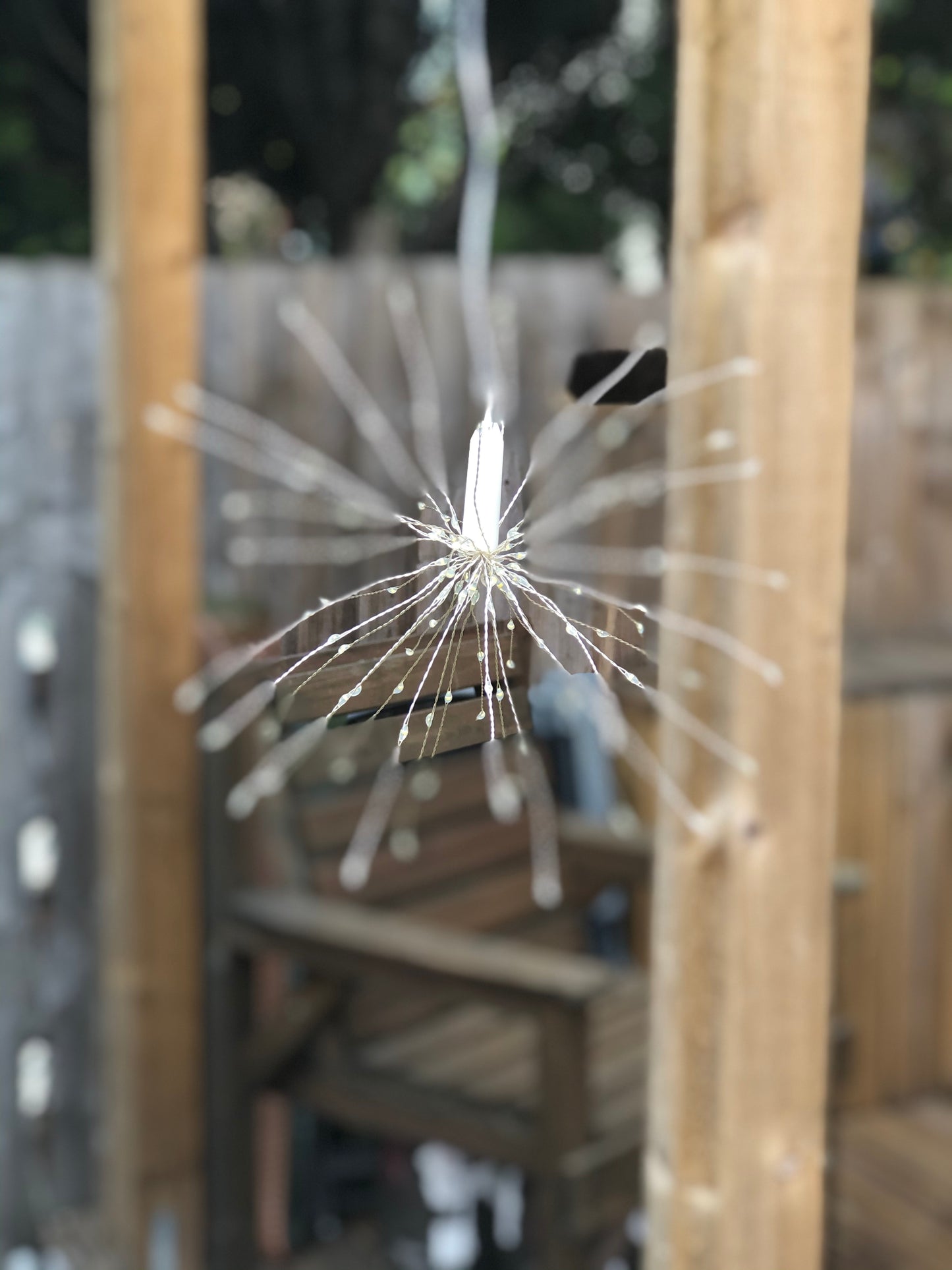 Hanging firework light warm light ornament. Battery operated use inside or outside.