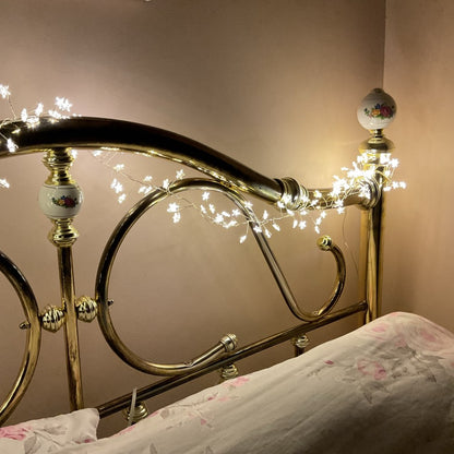 Warm white star Christmas lights decorating a headboard