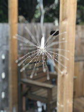 Load image into Gallery viewer, Hanging firework light warm light ornament. Battery operated use inside or outside.

